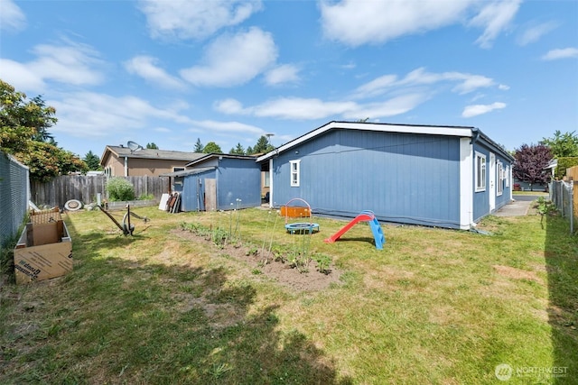 725 37th St SE Unit 36, Auburn, WA 98002 - back of property with a fenced backyard and a shed