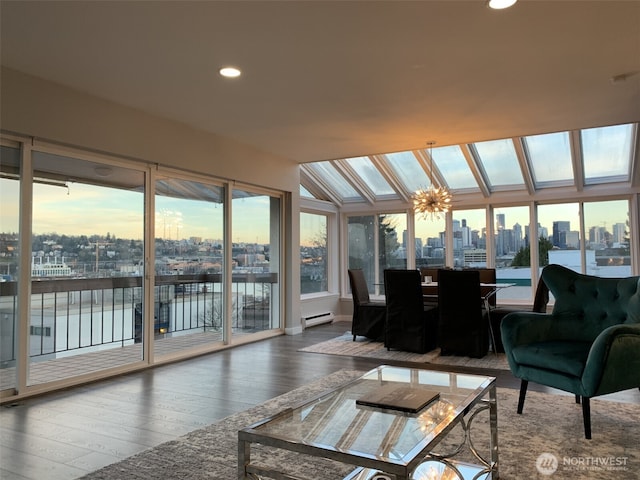 2010 Waverly Pl N, Seattle, WA 98109 - sunroom with a view of skyline, hardwood / wood-style flooring, a water view, vaulted ceiling, and a baseboard heating unit