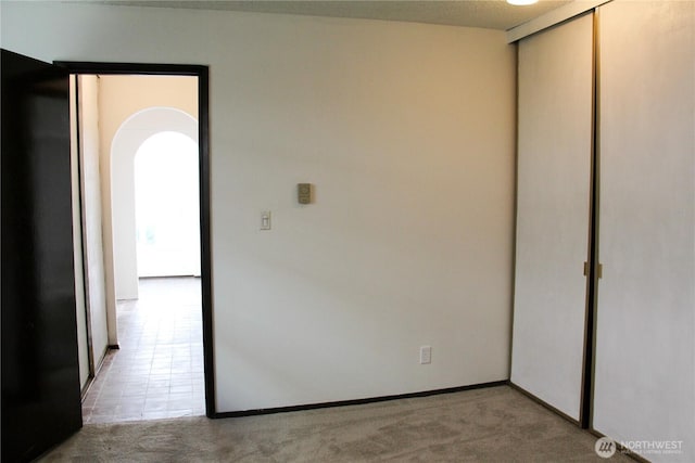 2010 Waverly Pl N, Seattle, WA 98109 - carpeted empty room featuring arched walkways