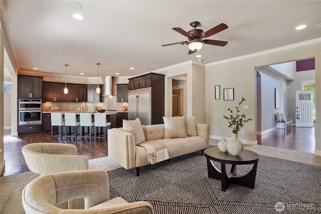 11214 172nd Street Ct E, Puyallup, WA 98374 - living room with a ceiling fan, recessed lighting, dark wood-style floors, and crown molding