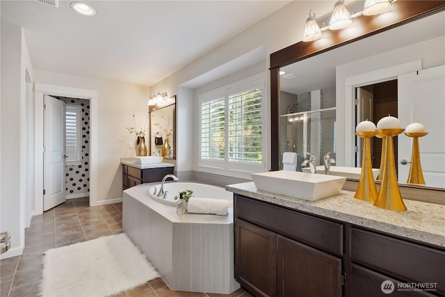 11214 172nd Street Ct E, Puyallup, WA 98374 - bathroom featuring a shower stall, two vanities, a bath, and tile patterned floors