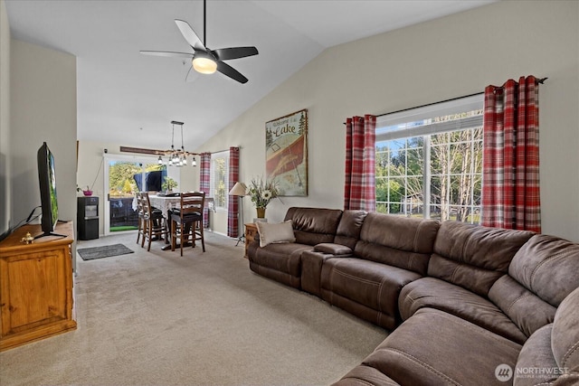 32421 Whitman Lake Dr E, Graham, WA 98338 - carpeted living area featuring lofted ceiling, a ceiling fan, and a chandelier