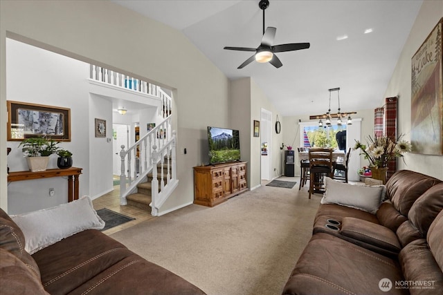 32421 Whitman Lake Dr E, Graham, WA 98338 - living area featuring lofted ceiling, ceiling fan, light colored carpet, stairway, and a chandelier
