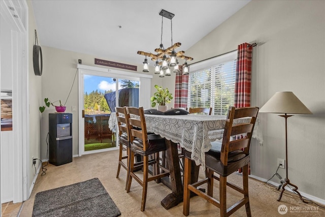 32421 Whitman Lake Dr E, Graham, WA 98338 - dining space featuring lofted ceiling, a chandelier, and light colored carpet