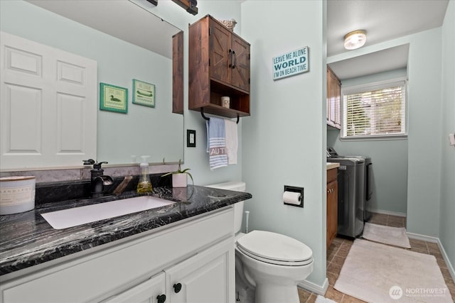 32421 Whitman Lake Dr E, Graham, WA 98338 - bathroom with separate washer and dryer, vanity, and tile patterned floors