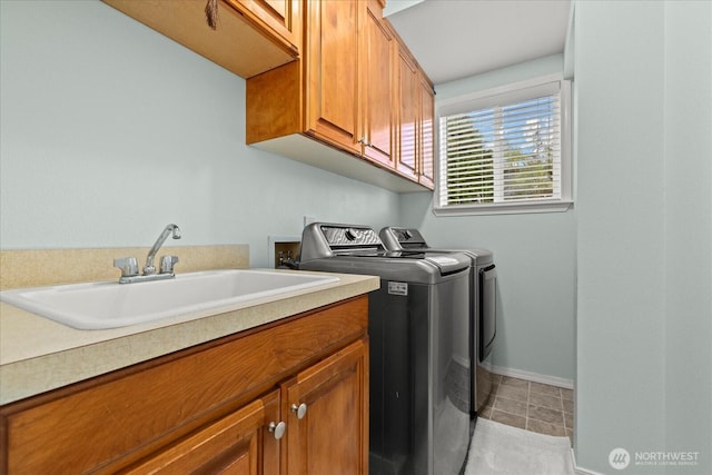 32421 Whitman Lake Dr E, Graham, WA 98338 - washroom featuring cabinet space, washer and dryer, and light tile patterned floors