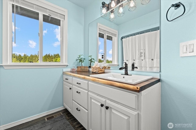32421 Whitman Lake Dr E, Graham, WA 98338 - full bathroom featuring vanity and wood finished floors