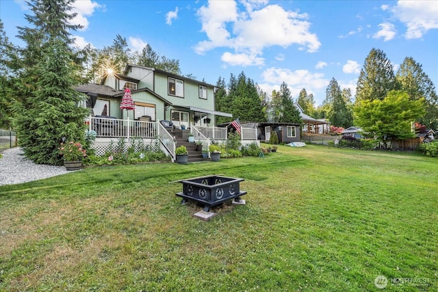 32421 Whitman Lake Dr E, Graham, WA 98338 - back of property with a wooden deck and an outdoor structure