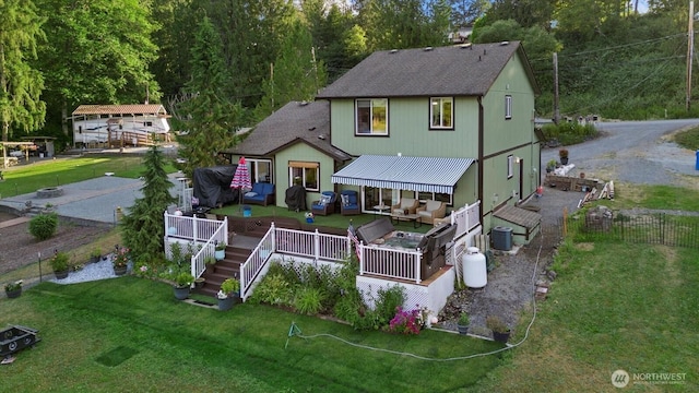 32421 Whitman Lake Dr E, Graham, WA 98338 - back of house featuring a shingled roof, a wooden deck, and an outdoor hangout area