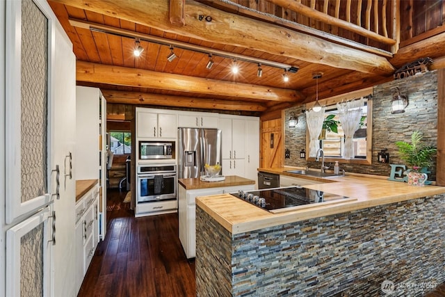 8209 271st Ave E, Buckley, WA 98321 - kitchen with wood counters, black appliances, rail lighting, dark wood-style floors, and white cabinets