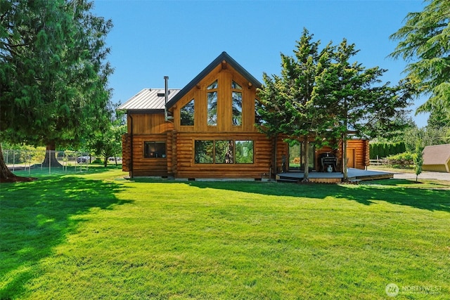 8209 271st Ave E, Buckley, WA 98321 - rear view of house featuring log siding, crawl space, a standing seam roof, and a metal roof