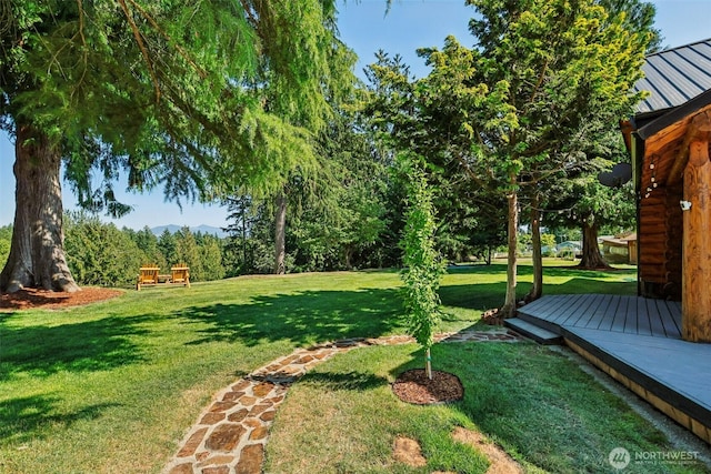 8209 271st Ave E, Buckley, WA 98321 - view of green lawn featuring a deck