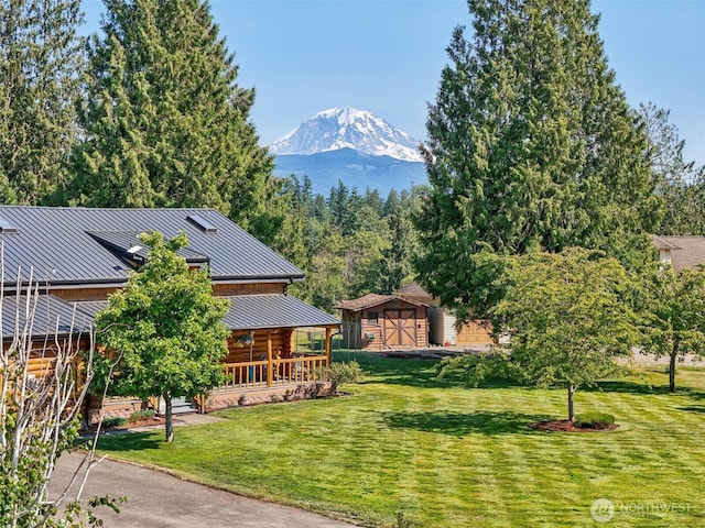 8209 271st Ave E, Buckley, WA 98321 - view of green lawn featuring a mountain view and a shed