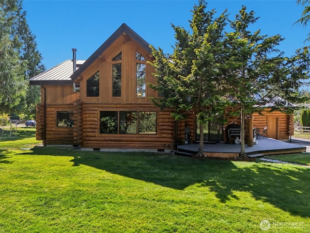 8209 271st Ave E, Buckley, WA 98321 - rear view of property with log exterior, a deck, a standing seam roof, and a lawn