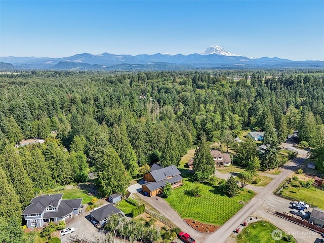 8209 271st Ave E, Buckley, WA 98321 - drone / aerial view of a heavily wooded area and a mountainous background