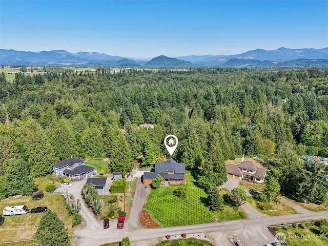 8209 271st Ave E, Buckley, WA 98321 - aerial view of a heavily wooded area and mountains