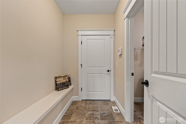 4837 Castleton Rd SW, Port Orchard, WA 98367 - hallway featuring baseboards and dark stone finish flooring