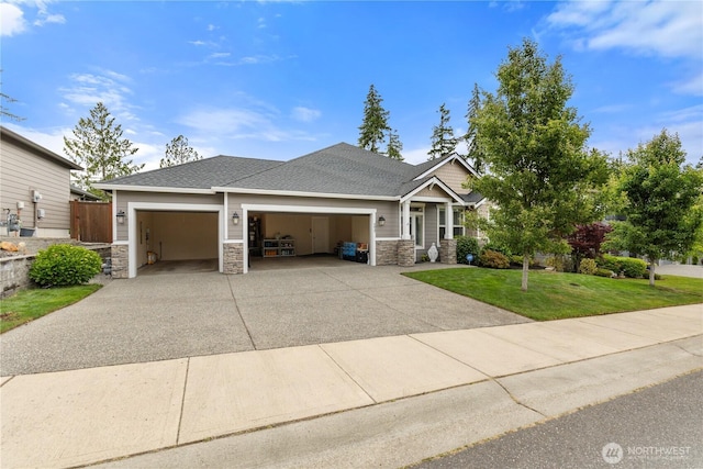 4837 Castleton Rd SW, Port Orchard, WA 98367 - craftsman inspired home featuring a garage, stone siding, a front yard, and concrete driveway