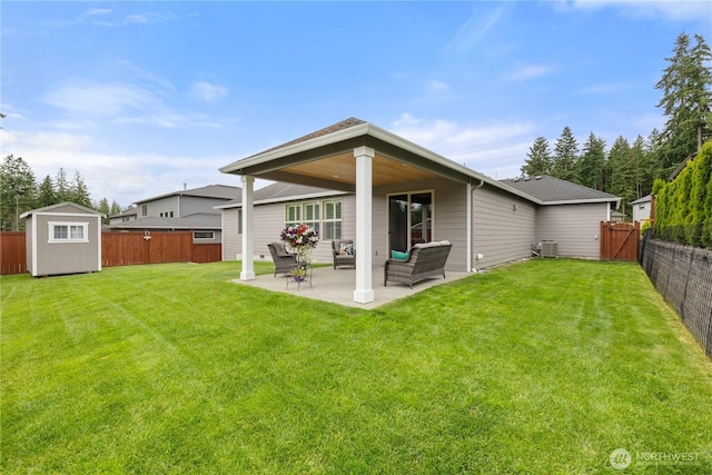 4837 Castleton Rd SW, Port Orchard, WA 98367 - back of property featuring a patio area, a fenced backyard, a storage unit, outdoor lounge area, and roof with shingles