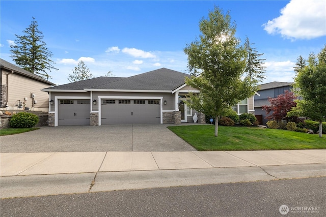 4837 Castleton Rd SW, Port Orchard, WA 98367 - view of front of home with stone siding, an attached garage, a front lawn, concrete driveway, and a shingled roof