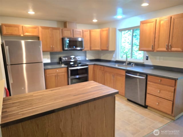 21724 E Terra Ln SE, Yelm, WA 98597 - kitchen featuring appliances with stainless steel finishes, butcher block countertops, and recessed lighting