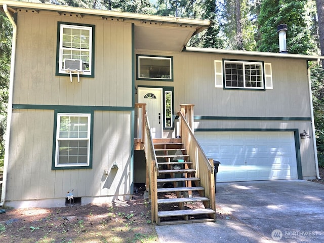21724 E Terra Ln SE, Yelm, WA 98597 - bi-level home with concrete driveway and an attached garage