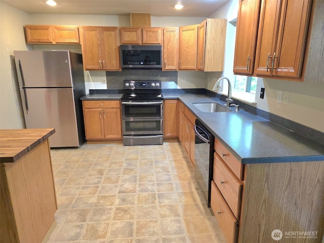 21724 E Terra Ln SE, Yelm, WA 98597 - kitchen with appliances with stainless steel finishes, butcher block counters, and recessed lighting