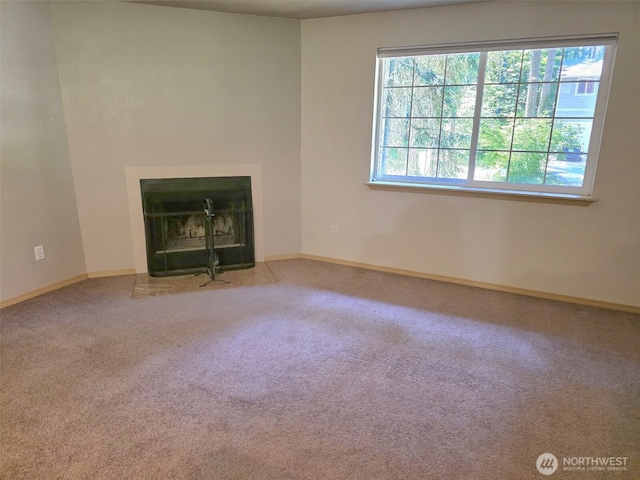 21724 E Terra Ln SE, Yelm, WA 98597 - unfurnished living room with carpet and a fireplace with flush hearth