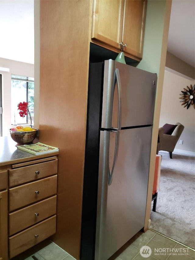 7924 212th St SW Unit 305, Edmonds, WA 98026 - kitchen with freestanding refrigerator, light colored carpet, and light tile patterned flooring