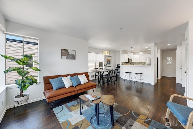 4026 Stone Way N Unit 501, Seattle, WA 98103 - living room featuring dark wood-type flooring and recessed lighting