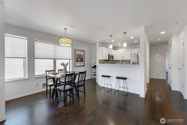 4026 Stone Way N Unit 501, Seattle, WA 98103 - dining room with dark wood-type flooring and recessed lighting