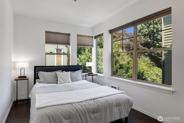 4026 Stone Way N Unit 501, Seattle, WA 98103 - bedroom featuring multiple windows and dark wood-style floors