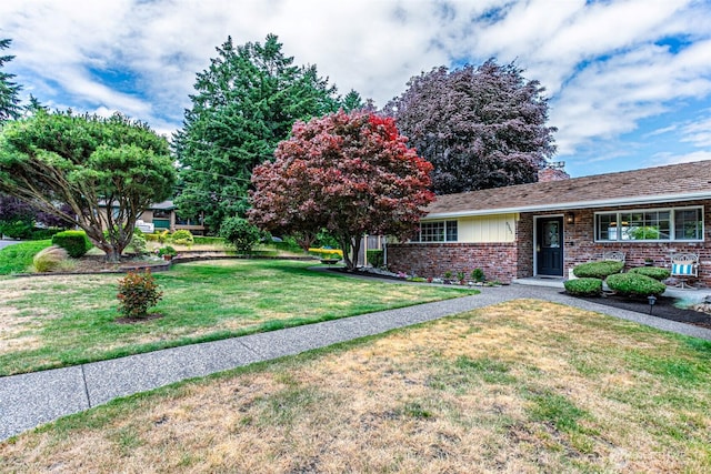 6301 Agnes Rd NE, Tacoma, WA 98422 - view of front of home featuring brick siding, a front yard, and a chimney