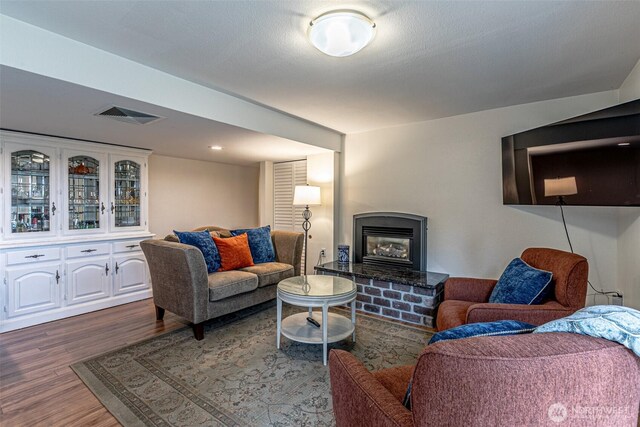 6301 Agnes Rd NE, Tacoma, WA 98422 - living area featuring wood finished floors and a glass covered fireplace