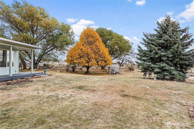 550 Red Tail Rd, Yakima, WA 98908 - view of green lawn with a storage unit