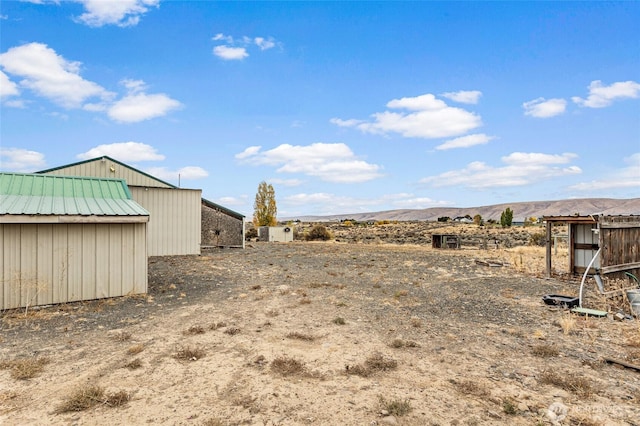 550 Red Tail Rd, Yakima, WA 98908 - view of yard featuring a mountain view and an outbuilding