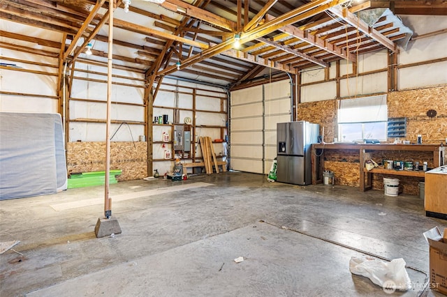 550 Red Tail Rd, Yakima, WA 98908 - garage featuring stainless steel fridge and a workshop area
