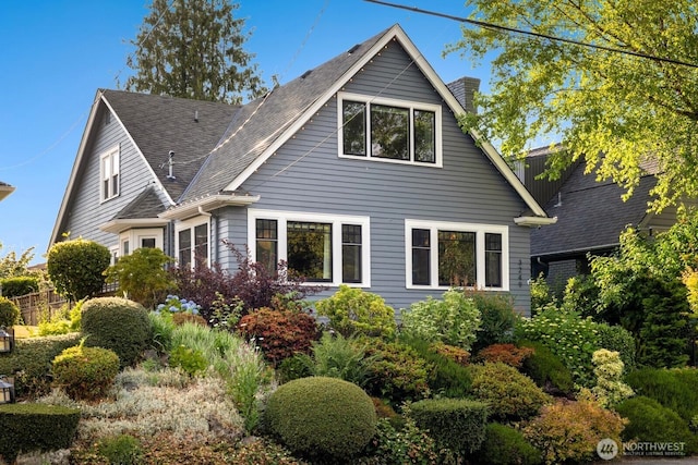 3249 27th Ave W, Seattle, WA 98199 - rear view of property featuring a chimney and roof with shingles