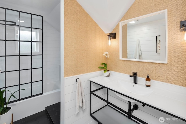 3249 27th Ave W, Seattle, WA 98199 - bathroom featuring vanity,  shower combination, vaulted ceiling, tile patterned flooring, and wallpapered walls