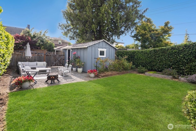 3249 27th Ave W, Seattle, WA 98199 - fenced backyard with a fire pit, a patio, and a storage shed