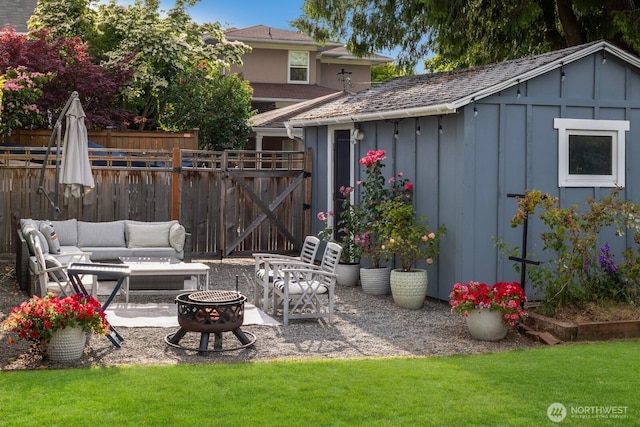 3249 27th Ave W, Seattle, WA 98199 - view of patio featuring an outdoor fire pit and an outdoor structure