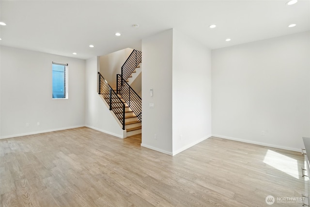 9732 Woodlawn Ave N Unit A, Seattle, WA 98103 - empty room featuring light wood finished floors, stairway, and recessed lighting