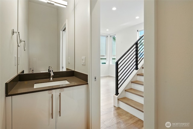 9732 Woodlawn Ave N Unit A, Seattle, WA 98103 - bathroom with wood finished floors, vanity, and recessed lighting