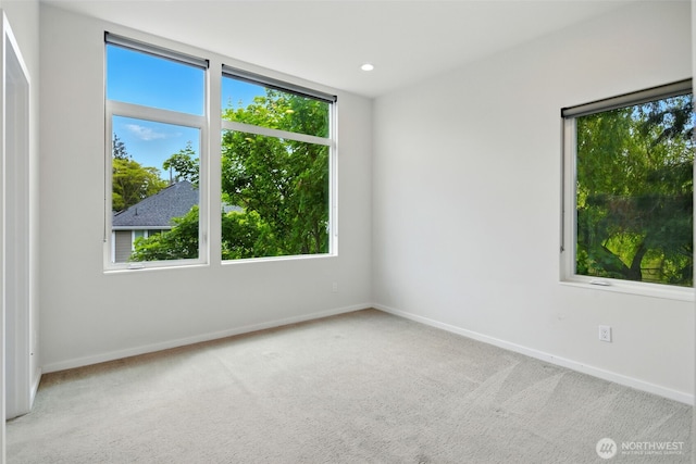 9732 Woodlawn Ave N Unit A, Seattle, WA 98103 - carpeted spare room featuring plenty of natural light and recessed lighting