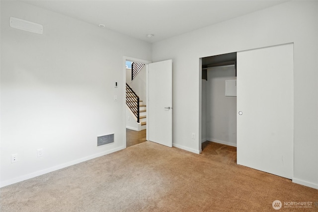 9732 Woodlawn Ave N Unit A, Seattle, WA 98103 - unfurnished bedroom featuring carpet floors and a closet