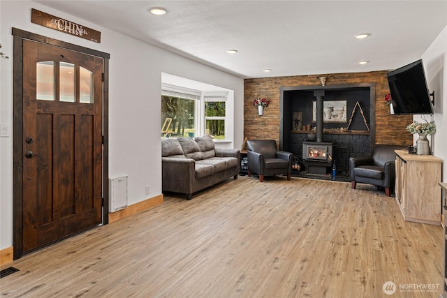 330 Swauk Creek Ln, Cle Elum, WA 98922 - living area featuring light wood-type flooring, a wood stove, and recessed lighting