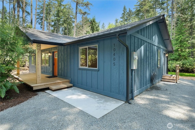 10405 Tahoma Dr, Anderson Island, WA 98303 - view of property exterior featuring board and batten siding and roof with shingles