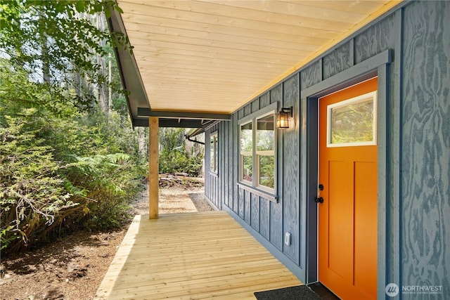 10405 Tahoma Dr, Anderson Island, WA 98303 - entrance to property featuring covered porch and board and batten siding