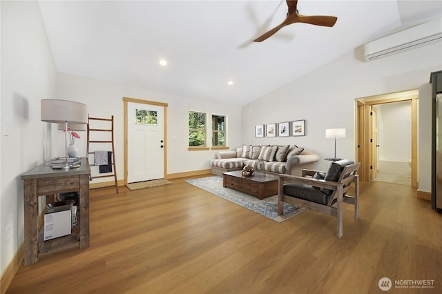 10405 Tahoma Dr, Anderson Island, WA 98303 - living area featuring a wall mounted AC, vaulted ceiling, light wood-style flooring, ceiling fan, and recessed lighting