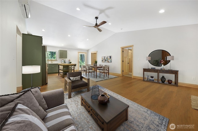 10405 Tahoma Dr, Anderson Island, WA 98303 - living area featuring a ceiling fan, a wall mounted AC, vaulted ceiling, light wood-style flooring, and recessed lighting